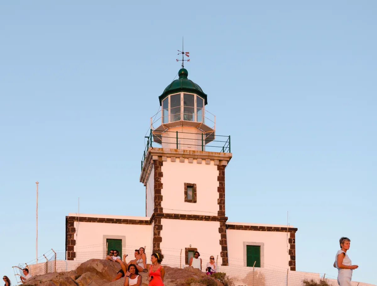 Akrotiri lighthouse on the south-west tip of Santorini, passed on a Santorini catamaran cruise