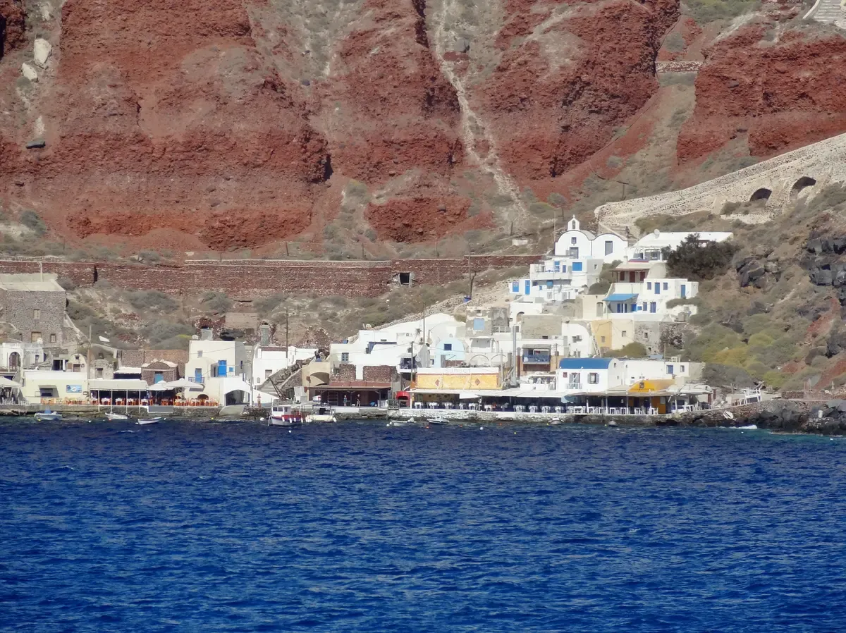 Ammoudi Bay below Oia with its small harbor on a Santorini catamaran cruise from Ammoudi