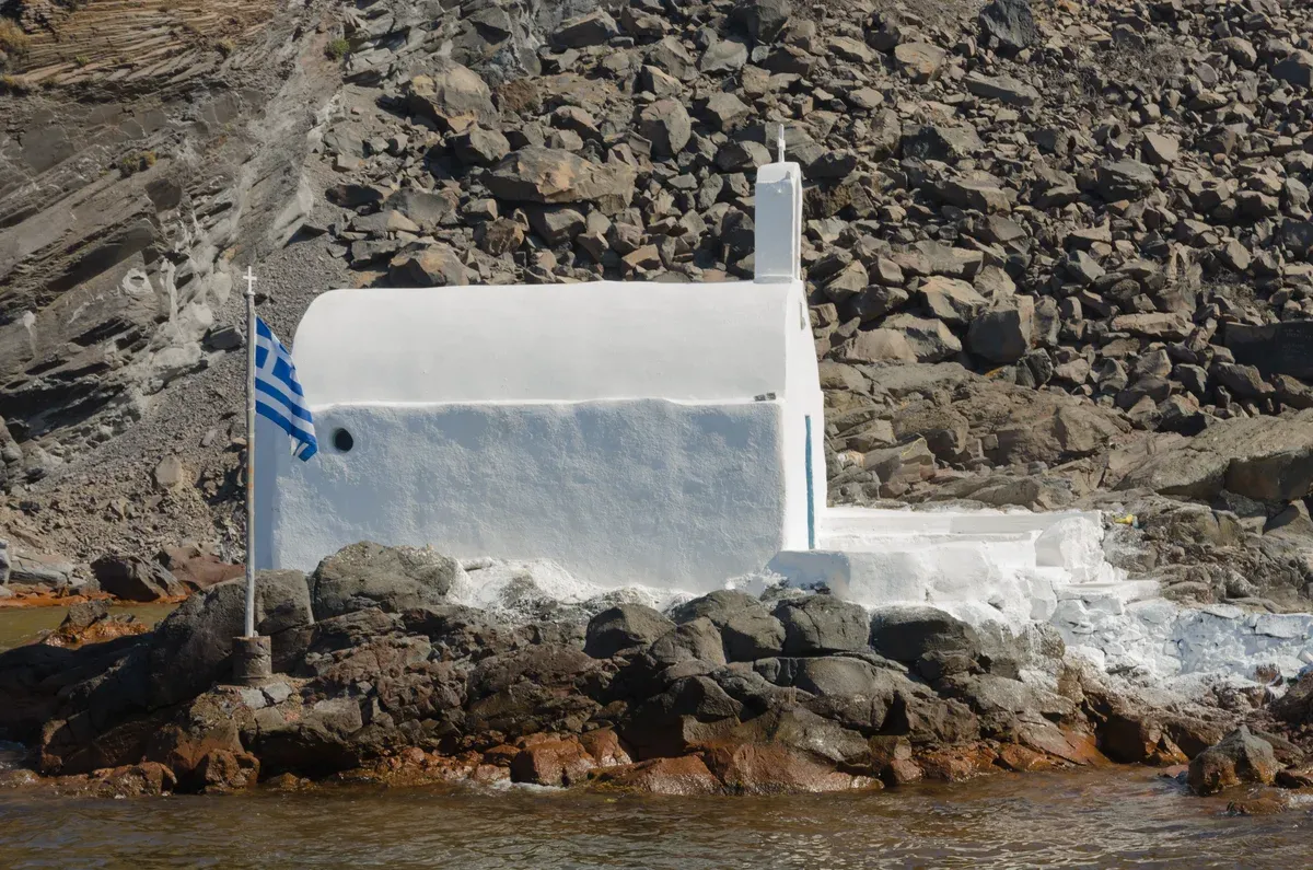 Chapel on Palea Kameni in the Santorini caldera, a stop on a Santorini catamaran cruise